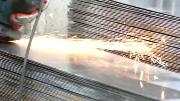 Person Works Grinder Cuts Steel Structures Factory Beautiful Sparks Fly — Stock Video