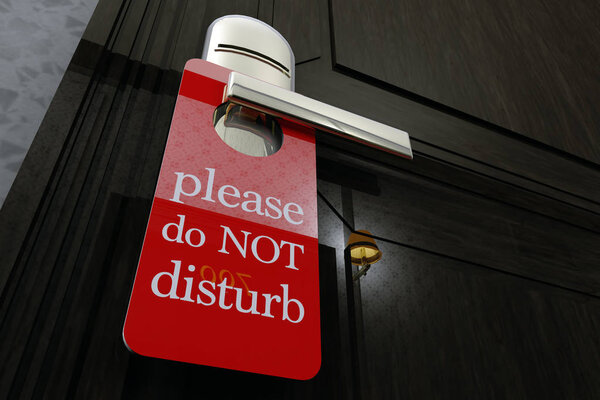 Don Not Disturb Sign Hanging on Room Door in a Fancy Hotel