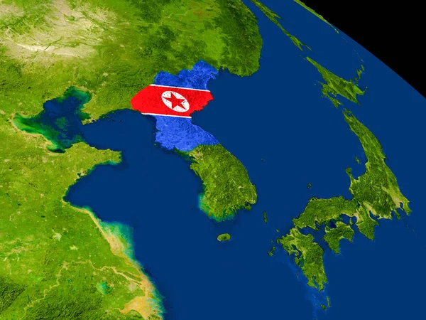 Kuzey Kore bayrağı yeryüzünde ile — Stok fotoğraf
