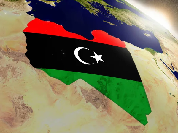 Libia z flagą w wschodzącego słońca — Zdjęcie stockowe
