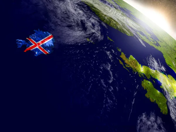 Island s vlajkou ve vycházejícím slunci — Stock fotografie