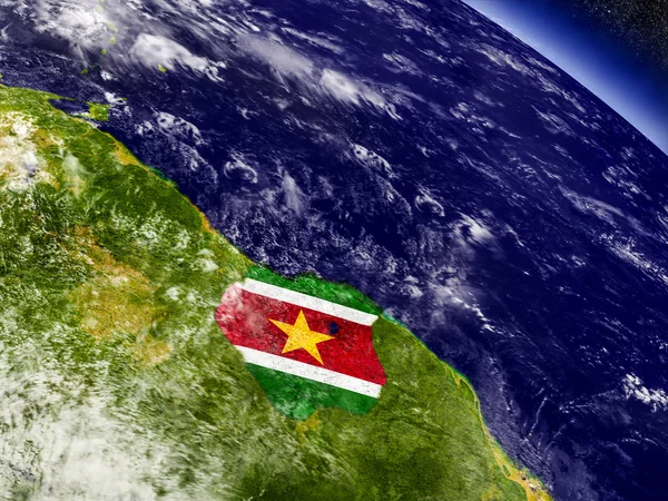 Суринам з вбудованим прапор на землі — стокове фото