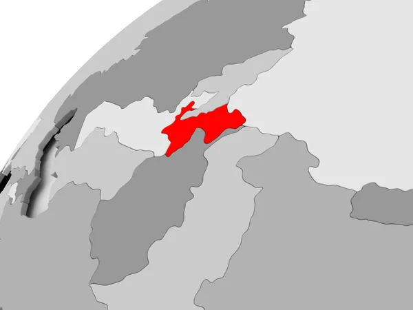 Таджикистан на сером политическом глобусе — стоковое фото