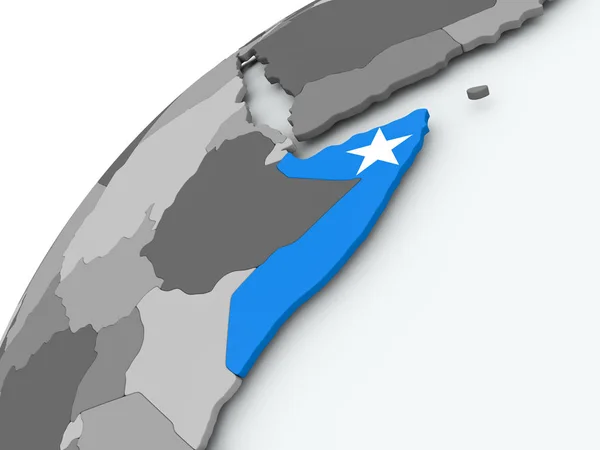 Somálská vlajka na šedý glóbus — Stock fotografie