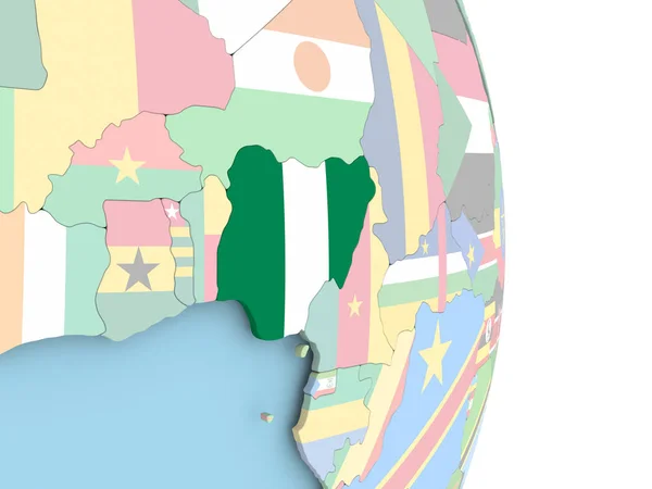 Nigeria met vlag op de wereldbol — Stockfoto