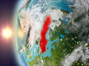 Uzaydan gelen gün batımı sırasında İsveç