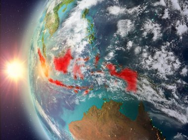 Uzaydan gelen gün batımı sırasında Endonezya
