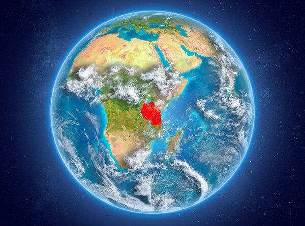 Tanzania in red on model of planet Earth with clouds and atmosphere in space. 3D illustration. Elements of this image furnished by NASA.