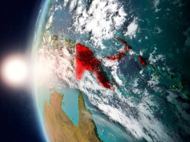 Yeryüzünde günbatımı sırasında Papua Yeni Gine