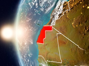 Yeryüzünde günbatımı sırasında Batı Sahra