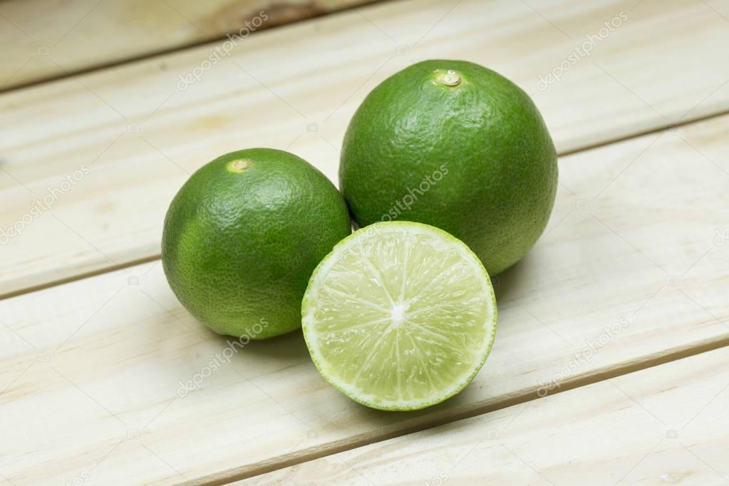 fresh green limes with half