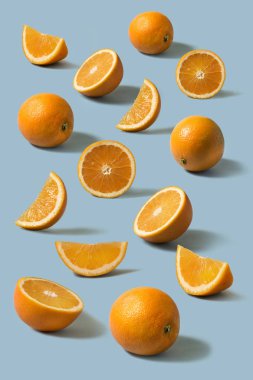 fresh whole and sliced oranges clipart