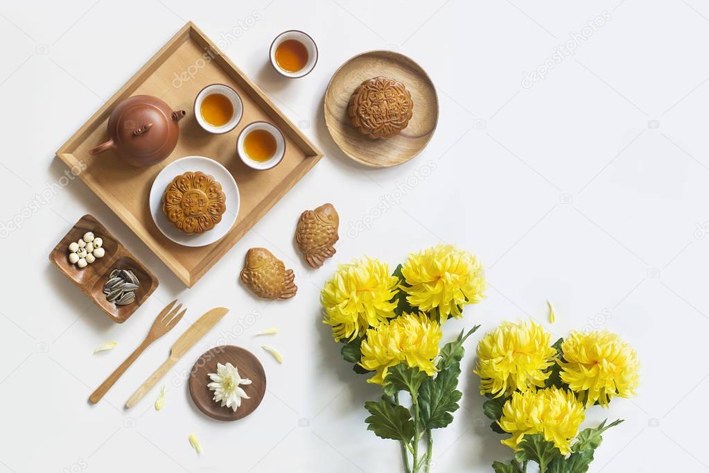 Conceptual flat lay mid-autumn festival food still life on white background.