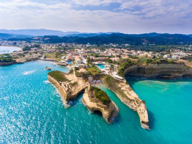 Canal D'Amour beach in Sidari, Corfu island, Greece. People bath clipart