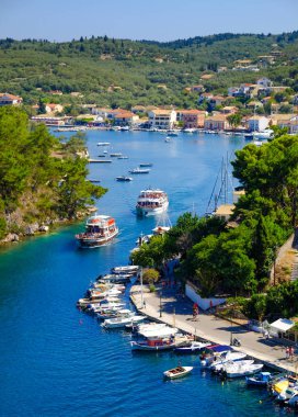 Paxos island with boat entering the grand canal clipart