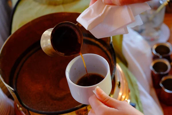 Making traditional greek / turkish black coffee on sand