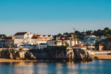 Cascais promenade sea view at sunrise in the morning. Cascais tr clipart