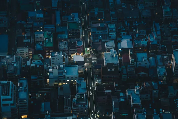 Tokyo city streets at night as seen from above aerial photograph