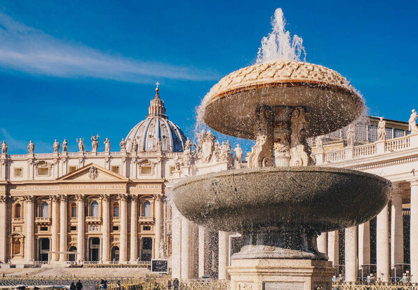 Saint Peter's Basilica and the fountain in front in Vatican City