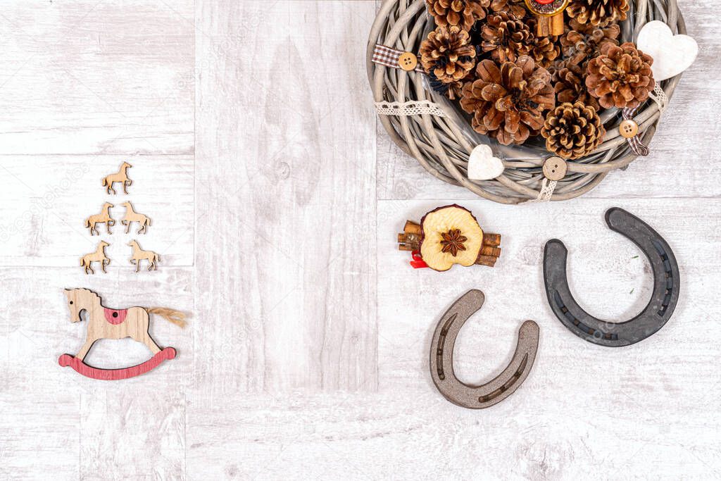 Old horseshoes as Xmas decorations on a wooden background