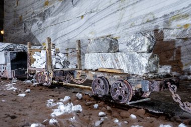 Old mining wagons inside the public Salt Mine at Slanic Prahova, Romania salt mine equipment inside the Slanic Prahova Salt mine clipart