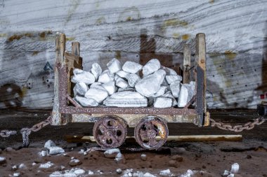 Old mining wagons inside the public Salt Mine at Slanic Prahova, Romania clipart