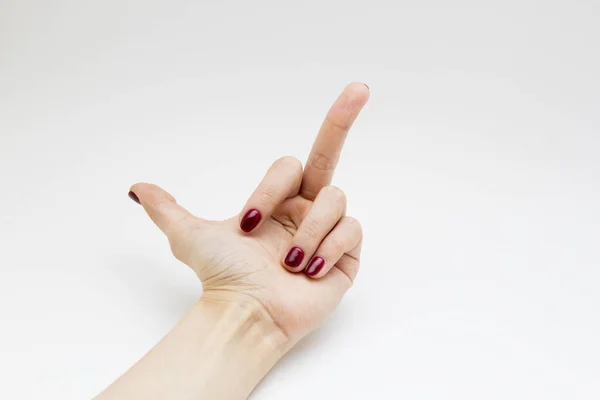 Manos con manicura roja sobre fondo blanco — Foto de Stock