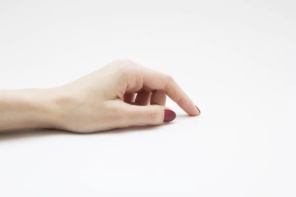 Manos con manicura roja sobre fondo blanco — Foto de Stock