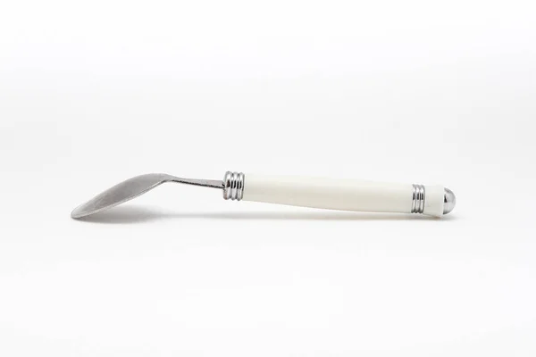 Metal spoon on a white background — Stock Photo, Image