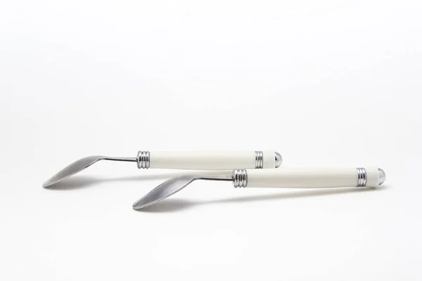 Metal spoon on a white background — Stock Photo, Image
