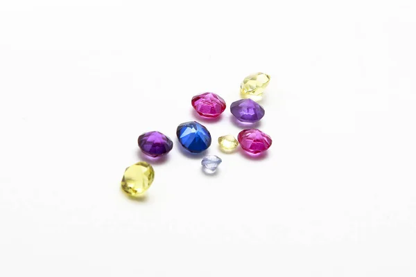 Faceted gems on a white background — Stock Photo, Image