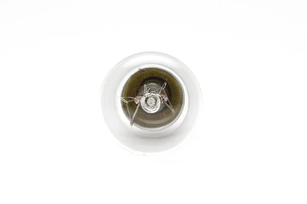Uma pequena lâmpada de incandescência sobre um fundo branco — Fotografia de Stock