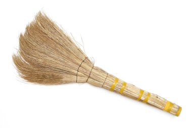 Beyaz arka plan üzerinde küçük bir süpürge