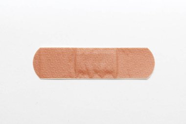 Medical adhesive plaster on white background
