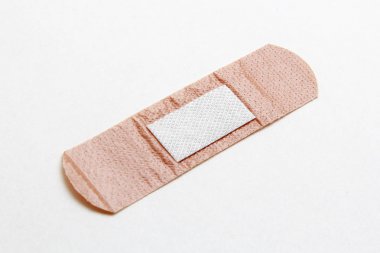 Medical adhesive plaster on white background