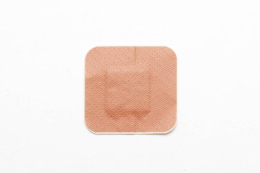Medical adhesive plaster on white background
