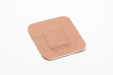 Medical adhesive plaster on white background