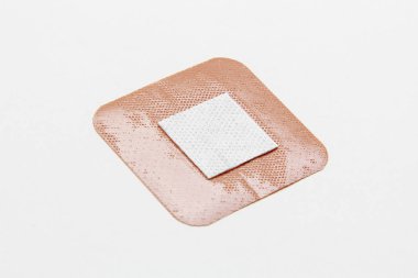 Medical adhesive plaster on white background