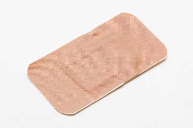 Medical adhesive plaster on white background