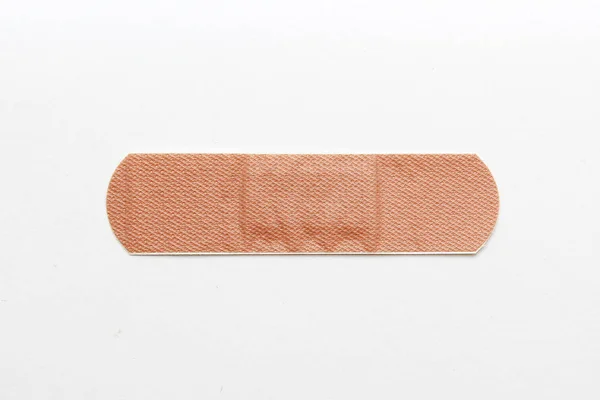 Medical adhesive plaster on white background — Stock Photo, Image