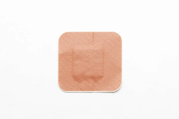 Medical adhesive plaster on white background