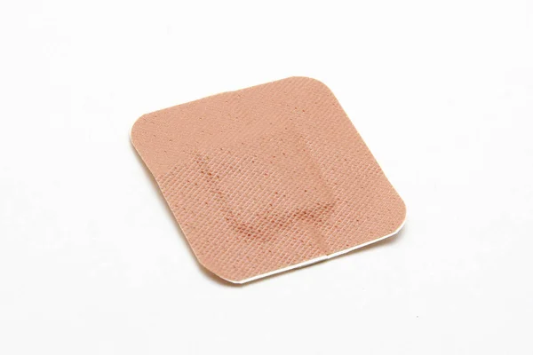 Medical adhesive plaster on white background