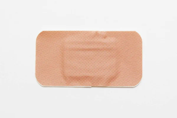 Medical adhesive plaster on white background