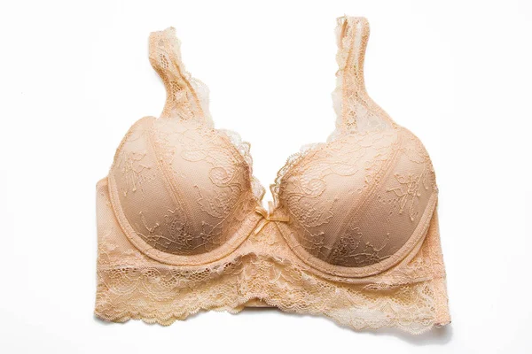 Indah lingerie beige pada latar belakang putih — Stok Foto