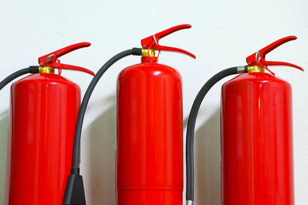 Red fire extinguishers. Fire-fighting equipment. — Stock Photo, Image