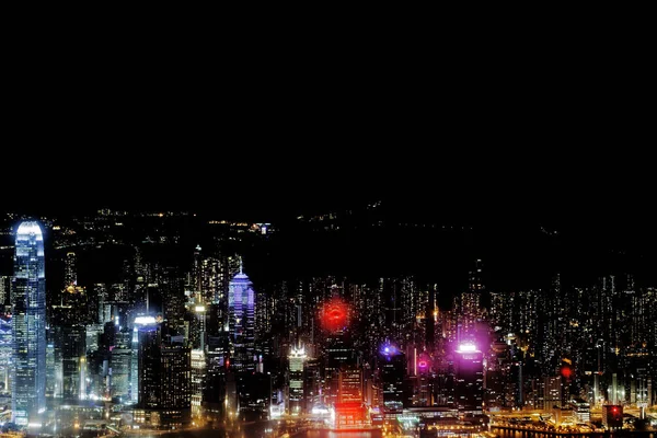 A bird eye view of the panoramic cityscape of Hong Kong, China at night