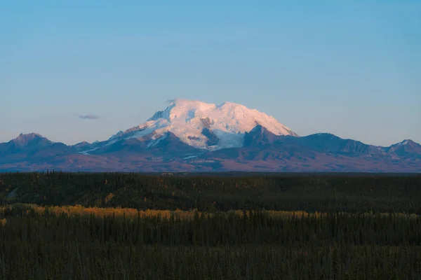 Mountains with glaciers and snow caps in autumn Stock Picture