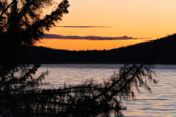 Sunrise during autumn with reflections on lake in Alaska — 스톡 사진