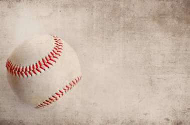 Baseball grunge background image, with heavy brown texture against old rugged white ball.  Great for sports or athletic image. clipart