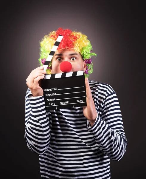 Funny clown with clipper box. — Stock Photo, Image